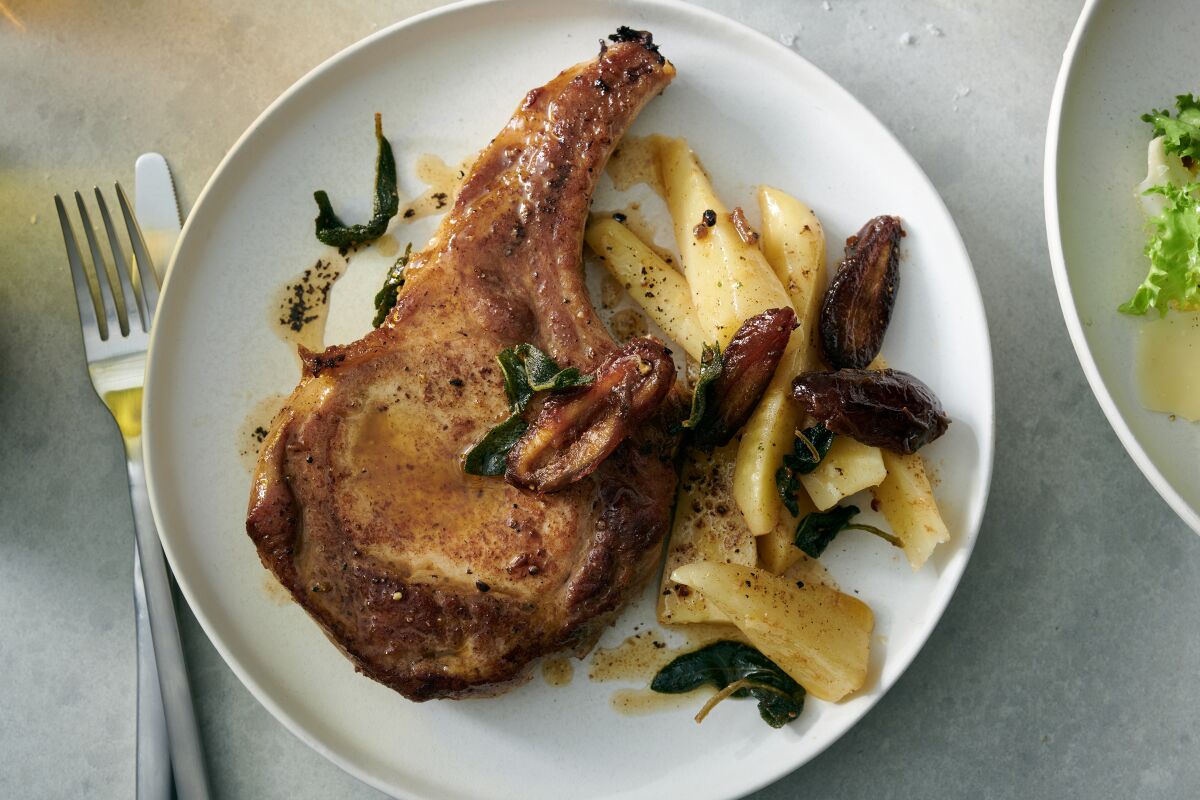 Pan-seared pork chops with sage, dates and parsnips.