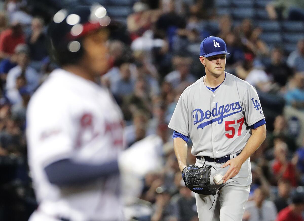 Starting pitcher Alex Wood, right, will be activated as soon as the Dodgers open a spot on the 40-man roster.