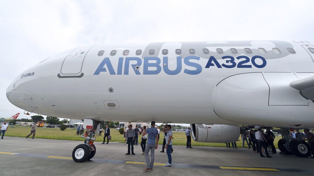 An A320neo passenger plane leaves its hangar at the Airbus plant in St.-Martin-du-Touch, near Toulouse, France.