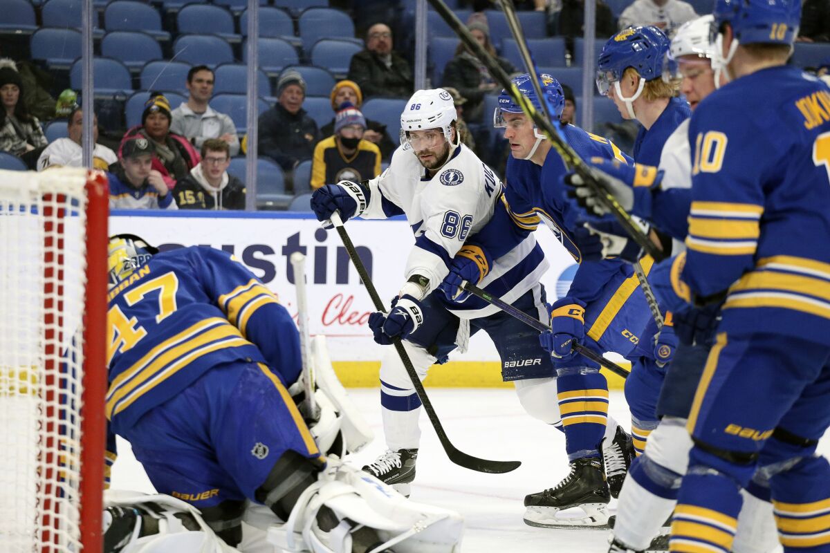 Tampa Bay Lightning right wing Nikita Kucherov (86) shoots during the second period of an NHL hockey game against the Buffalo Sabres on Tuesday, Jan. 11, 2022, in Buffalo, N.Y. (AP Photo/Joshua Bessex)