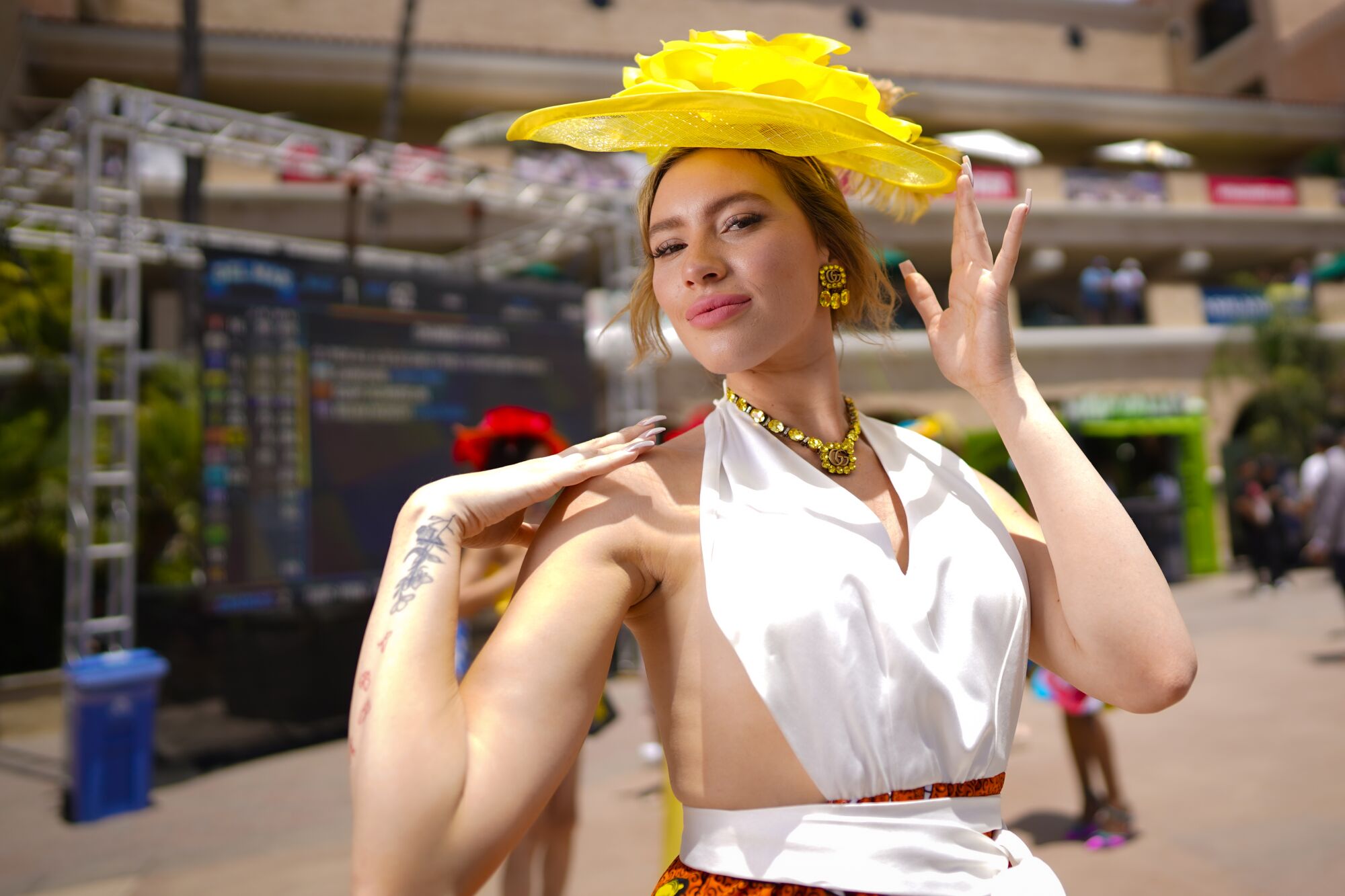 Lauren Mallak from San Diego was among the race fans taking part in the tradition of wearing hats on opening day.