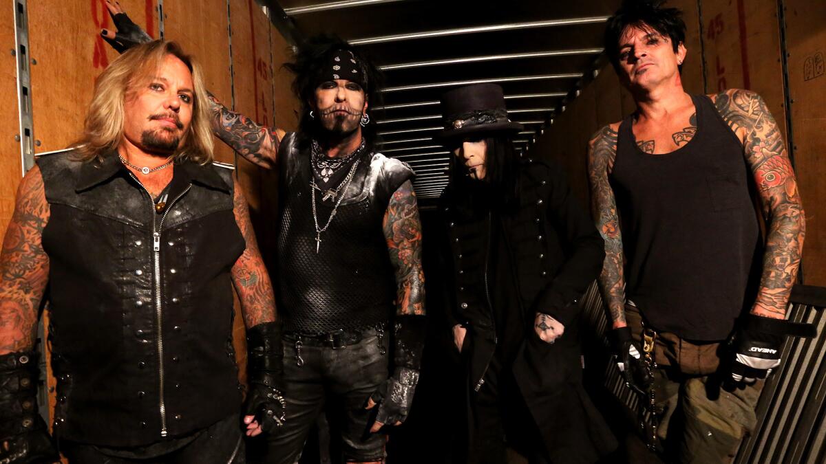 Motley Crue's Vince Neil, Nikki Sixx, Mick Mars and Tommy Lee minutes before taking the stage at the Matthew Knight Arena in Eugene, Oregon, on July 22, 2015.