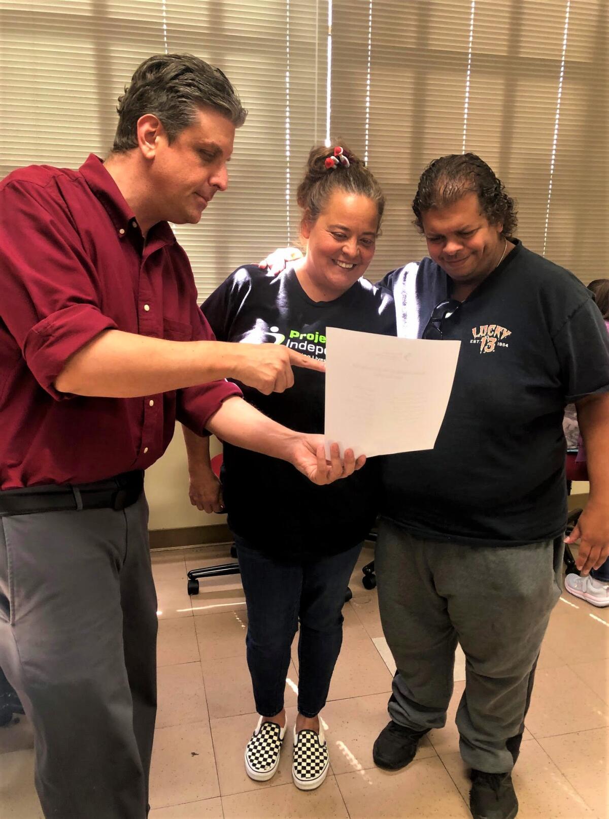 Chad Costello, with Costa Mesa nonprofit Project Independence goes over disaster preparedness tips in a training Wednesday.