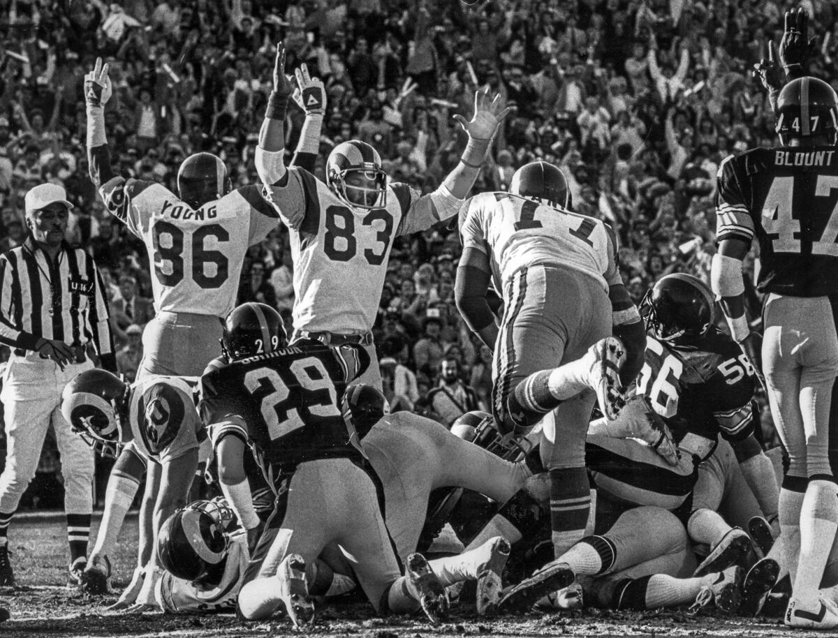 Jan. 20, 1980: The Rams' Charle Young (86) and Terry Nelson (83) help make the call after Cullen Bryant's one-yard touchdown run in the first quarter.