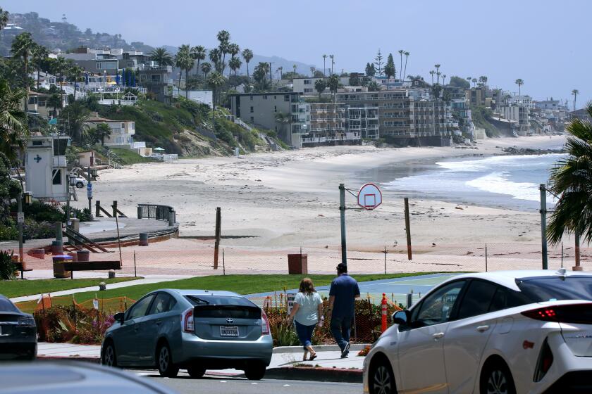 No one was seen on the beach after the city fenced off Main Beach Park along with the beach due to the coronavirus COVID-19 pandemic, in Laguna Beach on Saturday.