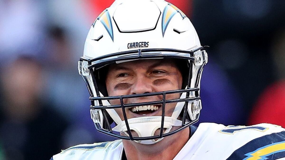 Philip Rivers celebrates after throwing a two-point conversion to Mike Williams against the Ravens in the AFC Wild Card Playoff game Jan. 6, 2018 at Baltimore.
