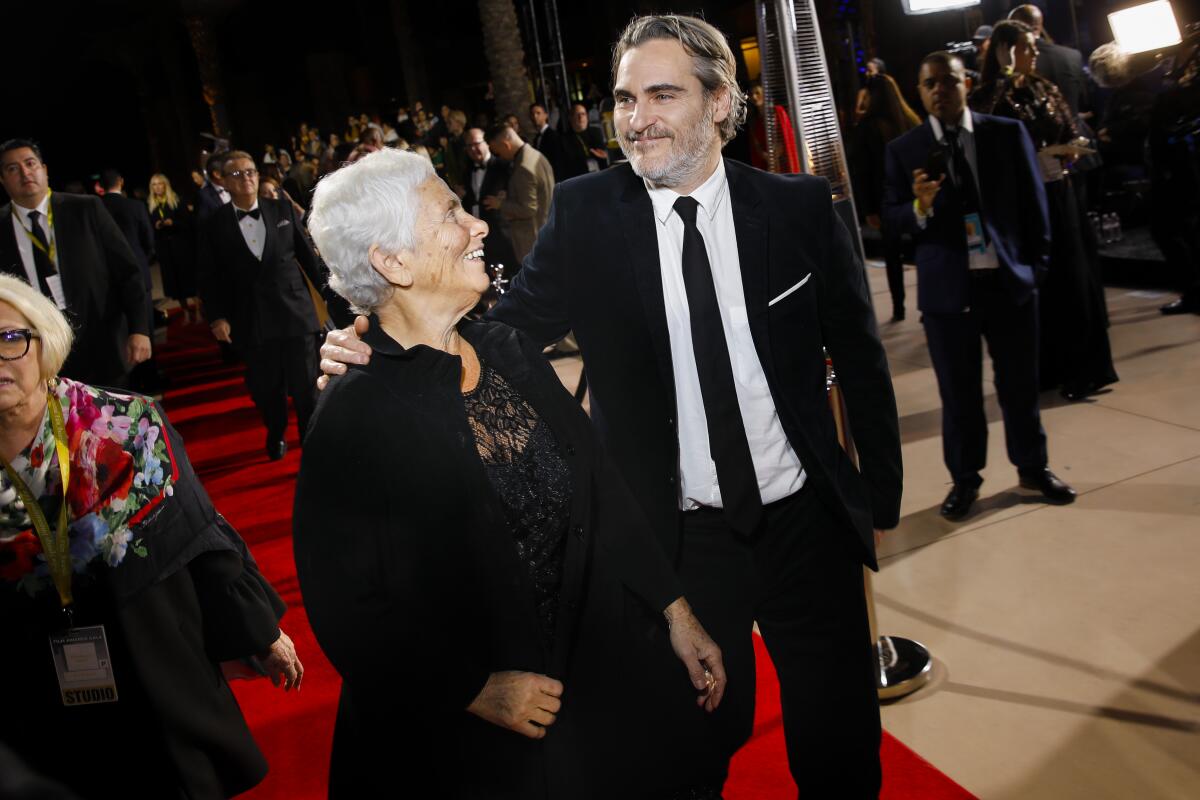 Actor Joaquin Phoenix arrives with his mother, Arlyn, at the Palm Springs International Film Festival Film Awards Gala