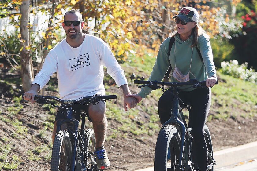 Clement Giraudet and Robin Wright are seen biking on November 28, 2020 in Los Angeles, Calif.