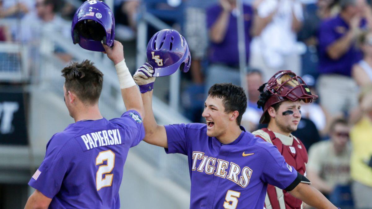 LSU's Jake Slaughter (5) celebrates his three-run home run in the second inning in a College World Series game against Florida State, Wednesday.