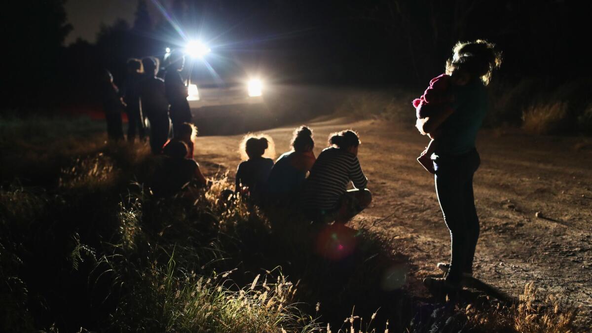 U.S. Border Patrol agents arrive to detain Central American asylum seekers near the U.S.-Mexico border in McAllen, Texas.