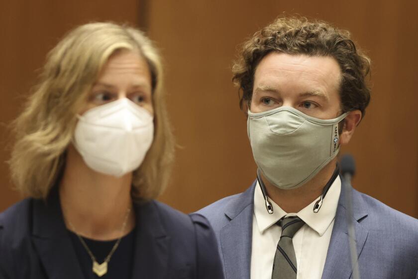 Actor Danny Masterson stands with his attorney Sharon Appelbaum during his arraignment in Los Angeles Superior Court in Los Angeles, Friday, Sept. 18, 2020. "That '70s Show" actor Masterson was arraigned on three rape charges. (Lucy Nicholson/Pool Photo via AP)