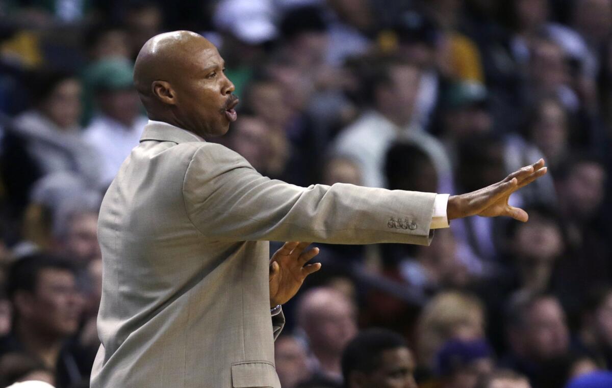Lakers Coach Byron Scott gives his squad directions during the first half against the Celtics.