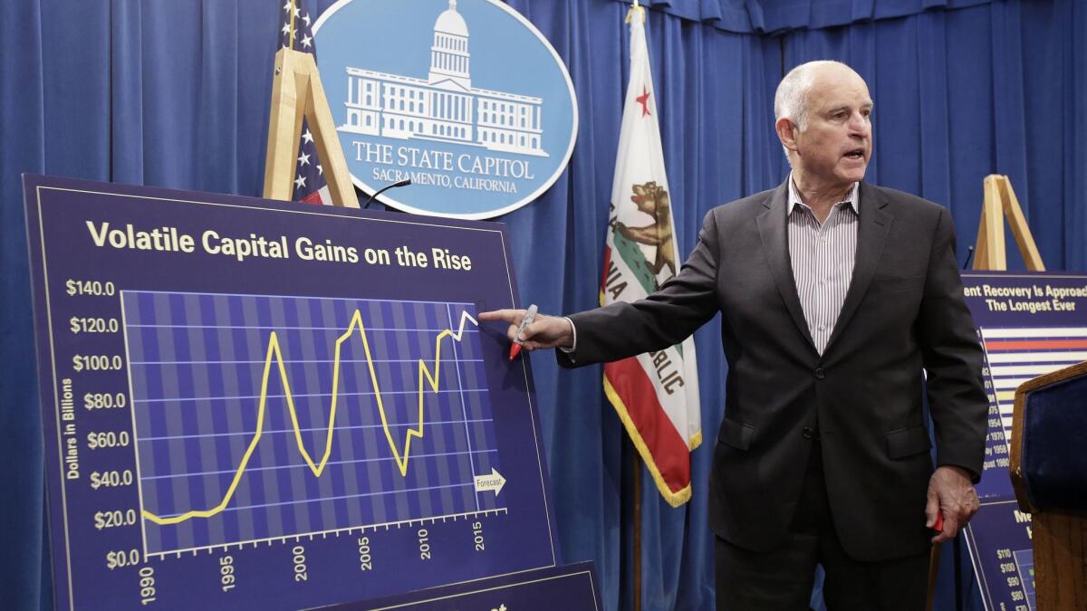 Gov. Jerry Brown discusses the volatility of capital gains revenue while discussing his revised 2018-19 state budget at a Capitol news conference Friday.