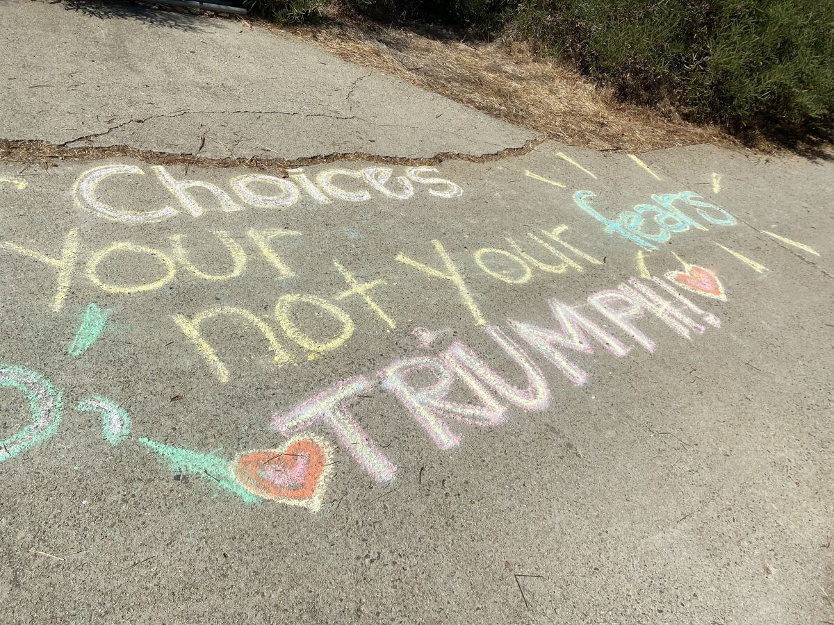The work "Trump" was spray painted under a message from the Oct. 31 ChalkUp, then turned into "Triumph" by Lisa Attinasi.