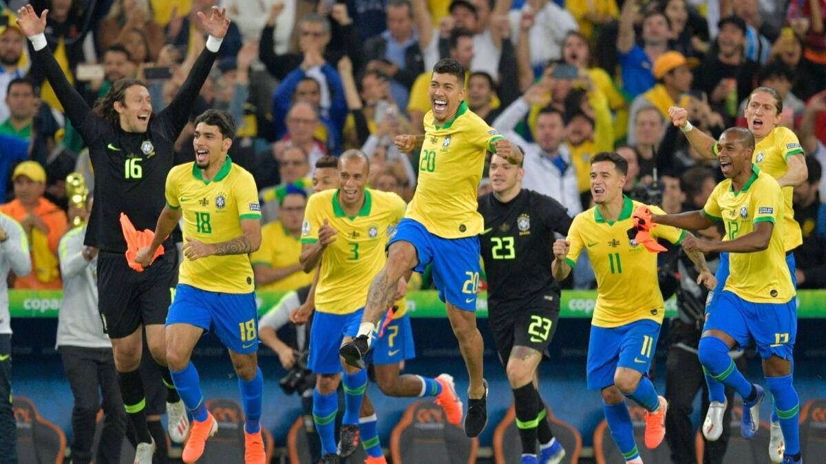 Brazil's players celebrate after defeating Peru to win the Copa America tournament at Maracana Stadium in Rio de Janeiro on Sunday.