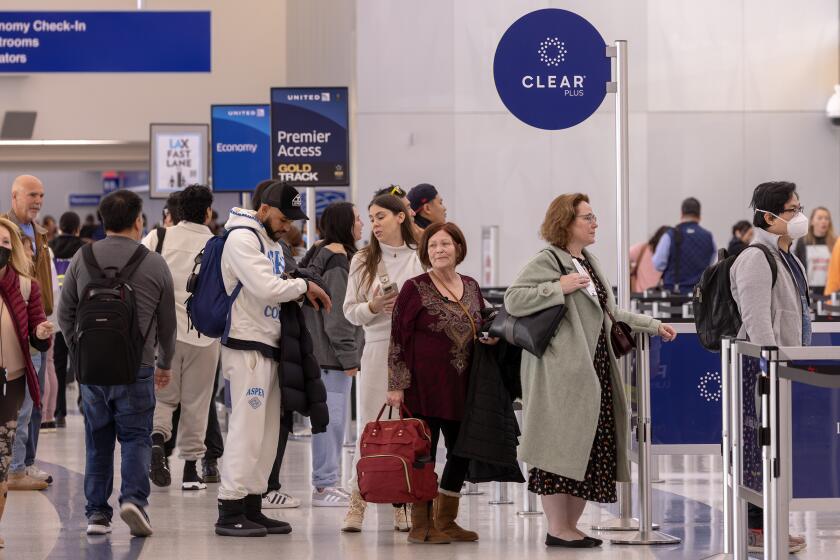 LOS ANGELES, CA - JANUARY 10: Passengers stand in Clear Plus line that gets them to their gate faster, using their eyes or fingerprints to verification, at Los Angeles International Airport on Wednesday, Jan. 10, 2024 in Los Angeles, CA. (Irfan Khan / Los Angeles Times)