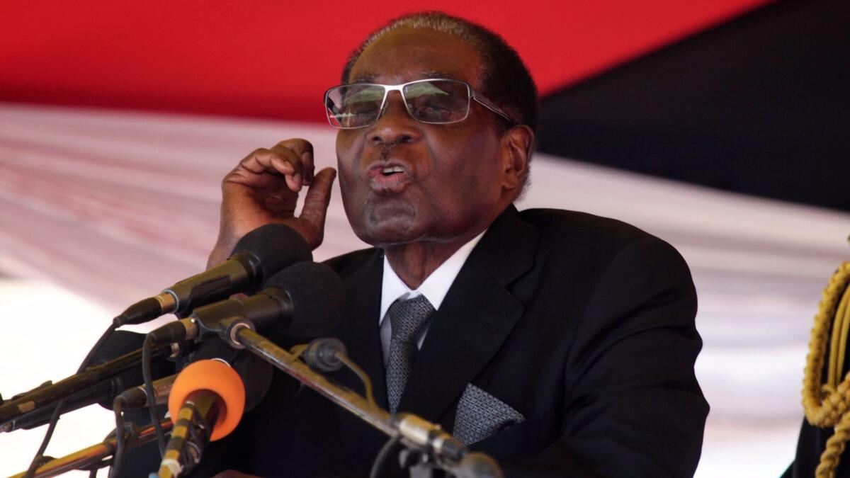 In a photo from earlier this week, Zimbabwean President Robert Mugabe addresses mourners at the Heroes Acre in Harare.