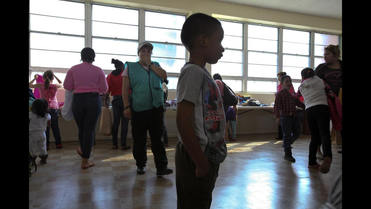 A school in Brownsville, Texas, is offering immigrants water, clothing and a place to wash up after their processing at the border.