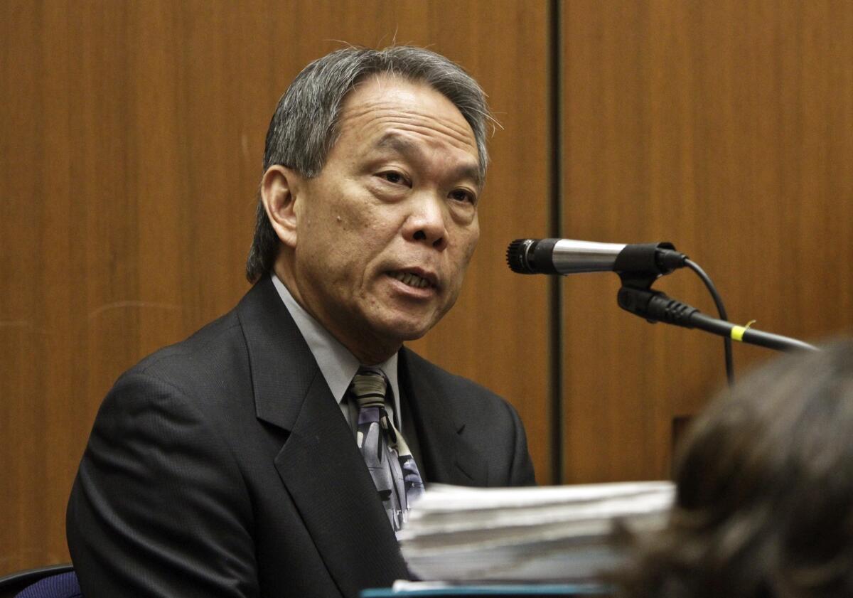Former Bell city attorney Edward Lee testifies during a 2011 hearing.