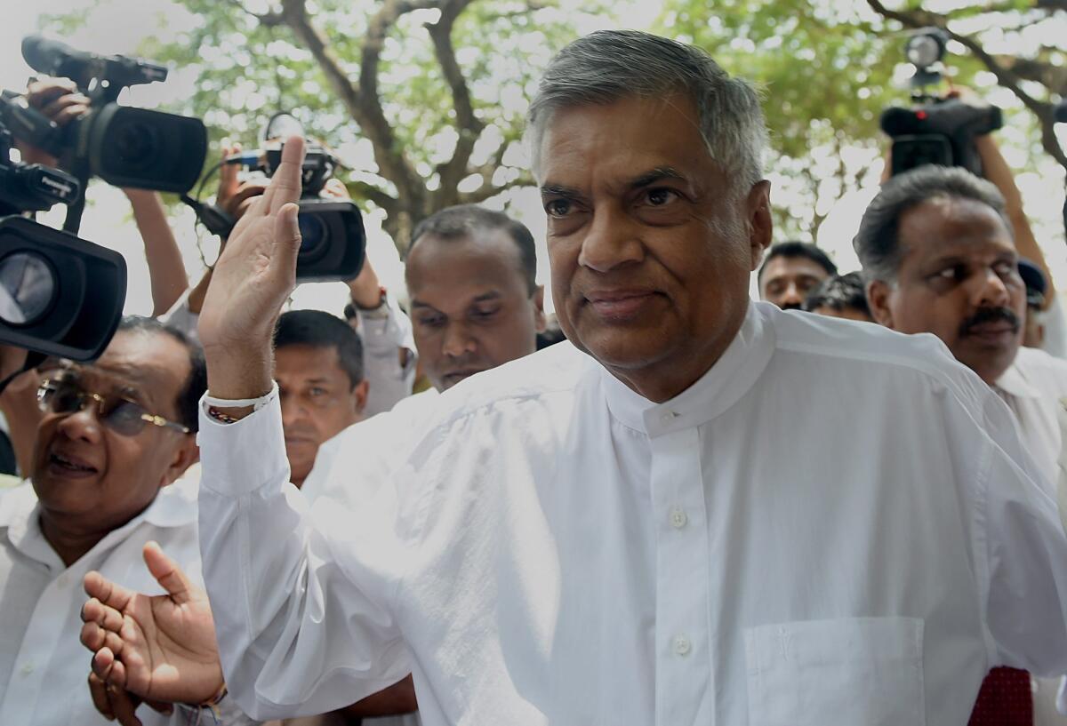 Sri Lankan Prime Minister Ranil Wickremesinghe arrives to cast his ballot in parliamentary elections at a polling station in Colombo on Aug. 17.