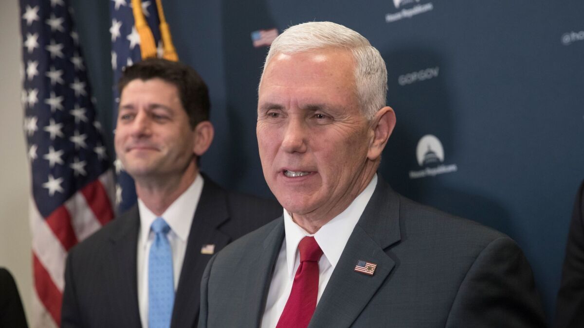 Smirking won't solve the problem: House Speaker Paul Ryan (R-Wis.), left, and Vice President-elect Mike Pence emerge from a meeting Wednesday to discuss a strategy to repeal Obamacare.