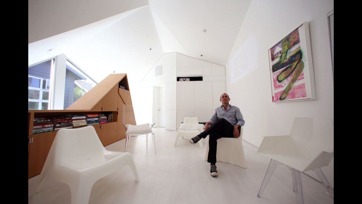 Just about any surface in the all-white interior can be used as a screen, architect Daniel Monti says of the Amoroso Project, the private space he designed for a collector of video art.