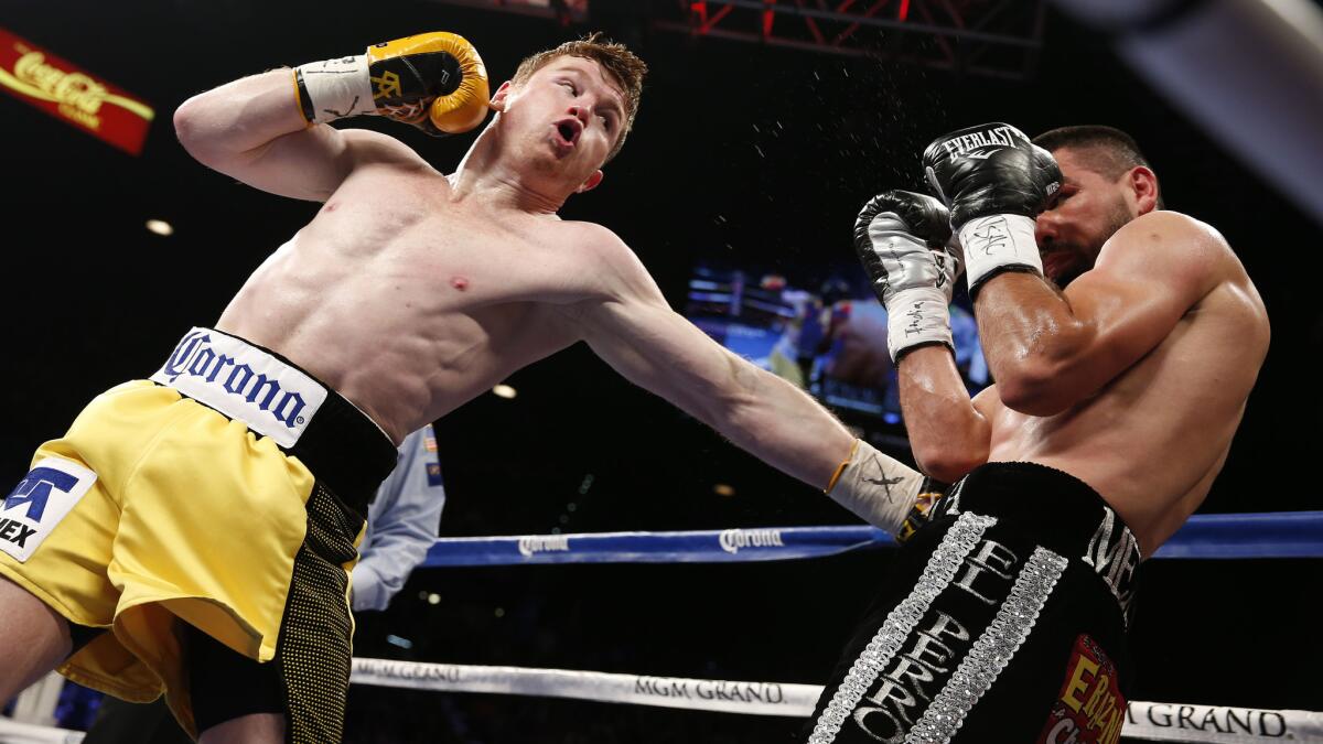 Saul "Canelo" Alvarez, left, punches Alfredo Angulo during a super-welterweight fight in Las Vegas on March 8, 2014.