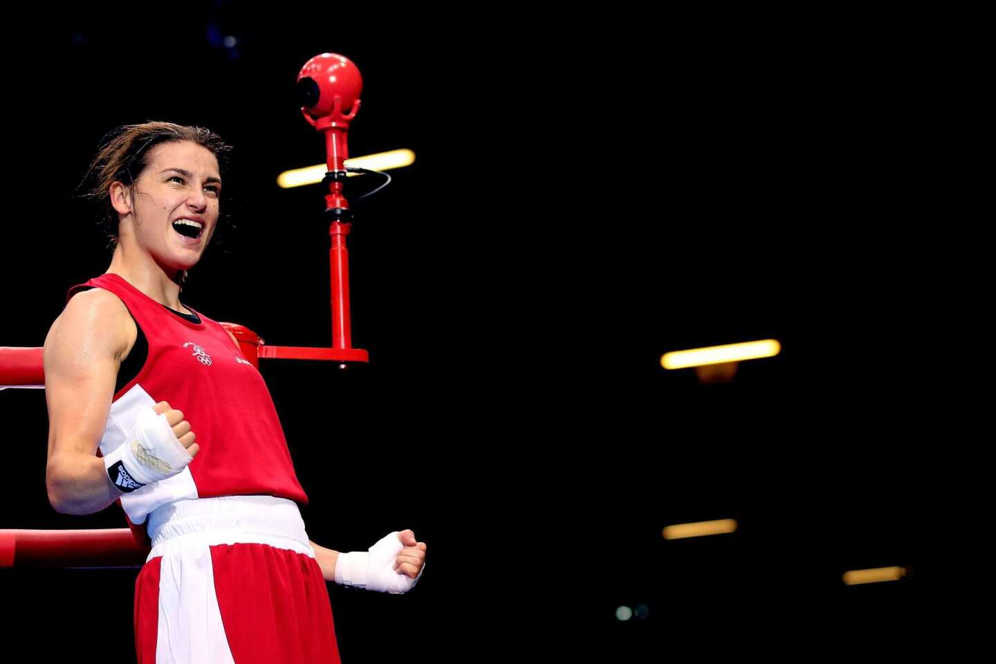 Katie Taylor of Ireland celebrates after defeating Natasha Jonas of Great Britain in the women's lightweight boxing quarterfinals.