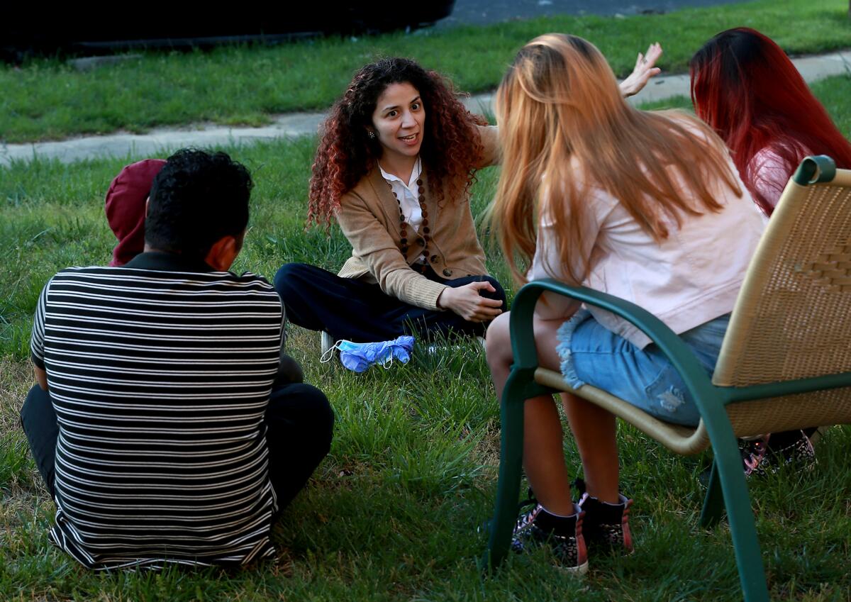 Attorney Claudia Cubas talks to Jose and his children in April