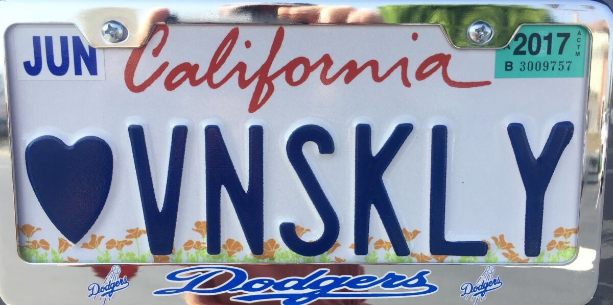Melinda Holcomb dedicated her license plate to Vin Scully.