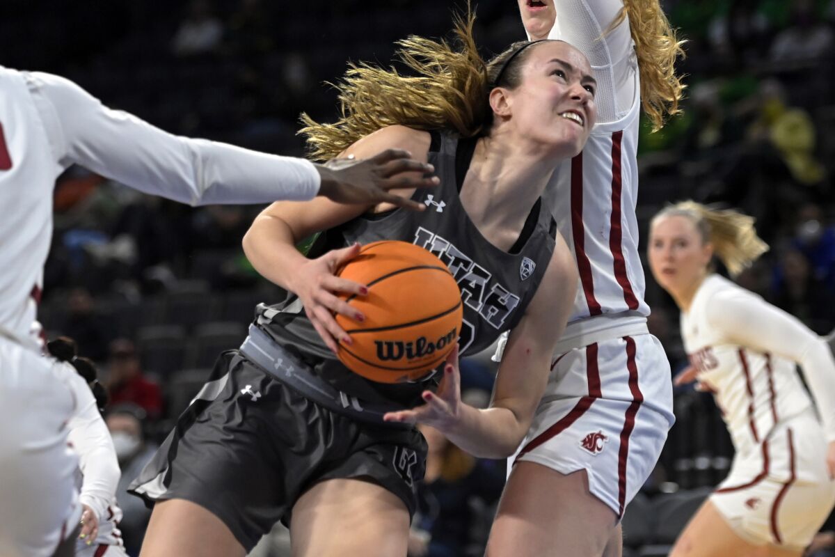 Utah forward Jenna Johnson (22) drives to the basket against Washington State during the second half of an NCAA college basketball game in the quarterfinals of the Pac-12 women's tournament Thursday, March 3, 2022, in Las Vegas. (AP Photo/David Becker)