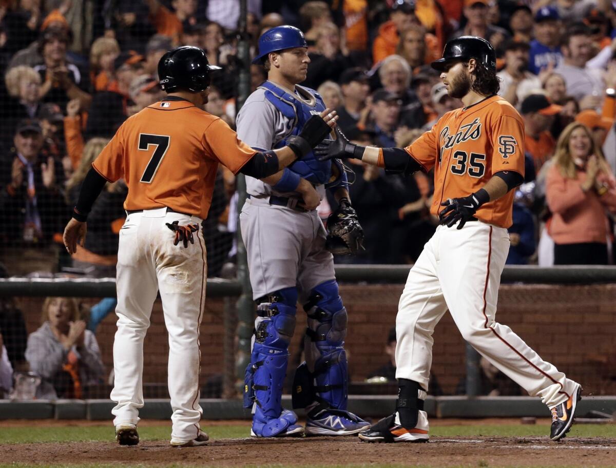 San Francisco's Brandon Crawford, right, celebrates after hitting a two-run home run in the fifth inning.