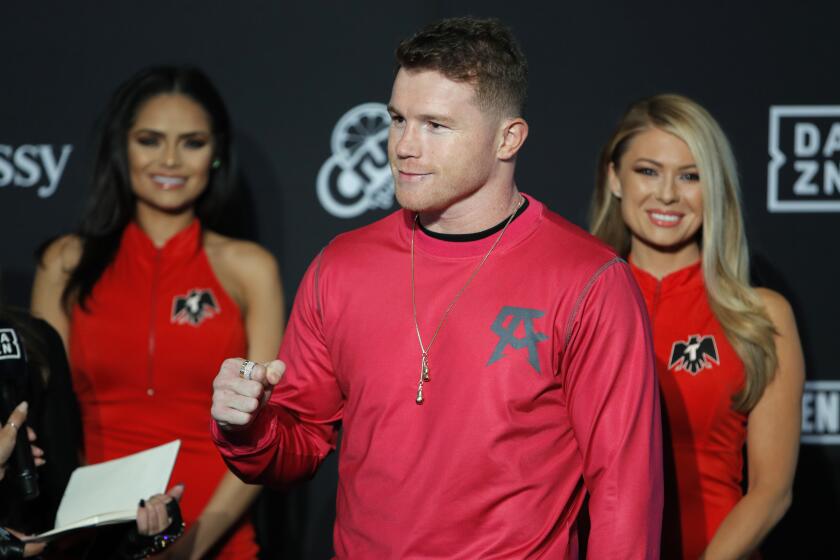 Canelo Alvarez motions to the crowd during a ceremonial arrival for an upcoming boxing match, Tuesday, Oct. 29, 2019, in Las Vegas. Alvarez is scheduled to fight Sergey Kovalev in a WBO light heavyweight title bout Saturday in Las Vegas. (AP Photo/John Locher)