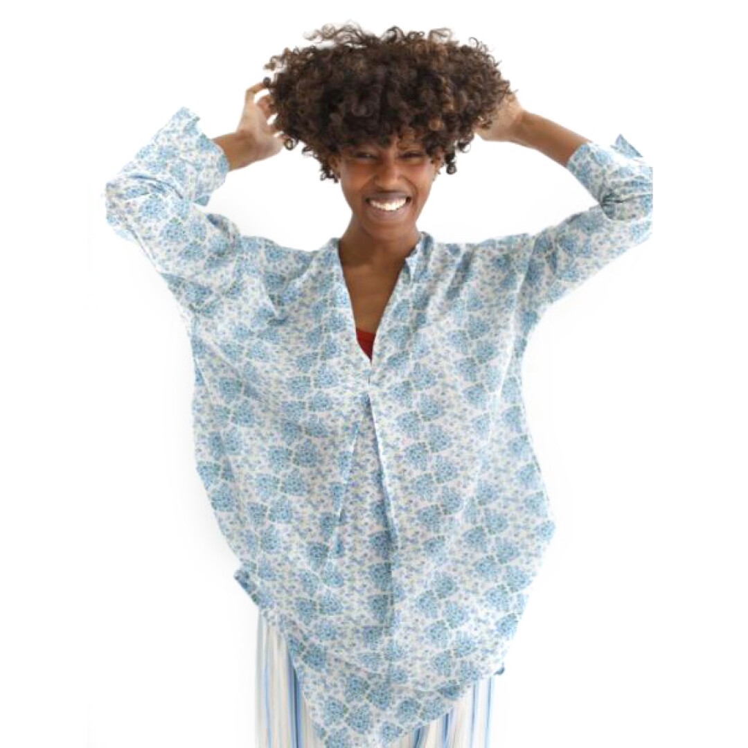 A woman wearing a blue sleep tunic