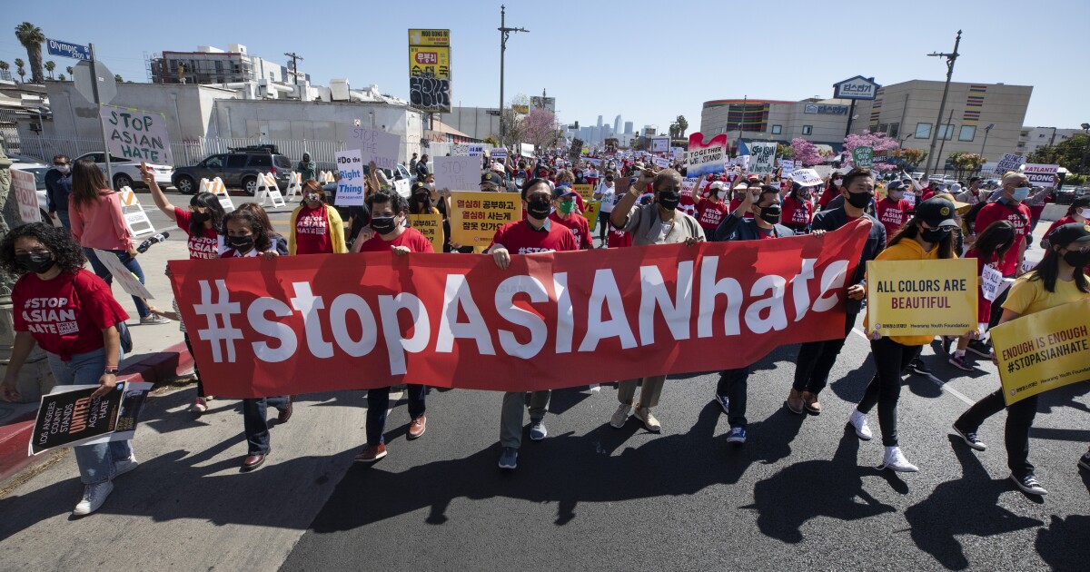 Hundreds of people march in Koreatown, Los Angeles, as part of the “Stop Asian Hate” rallies across the country