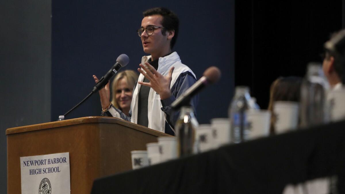 Senior Johnny Lujan, a One-On-Campus ambassador at Corona del Mar High School, speaks during an awareness panel presented by One Recovery on Wednesday night at Newport Harbor High School in response to a recent off-campus student party featuring Nazi symbols.