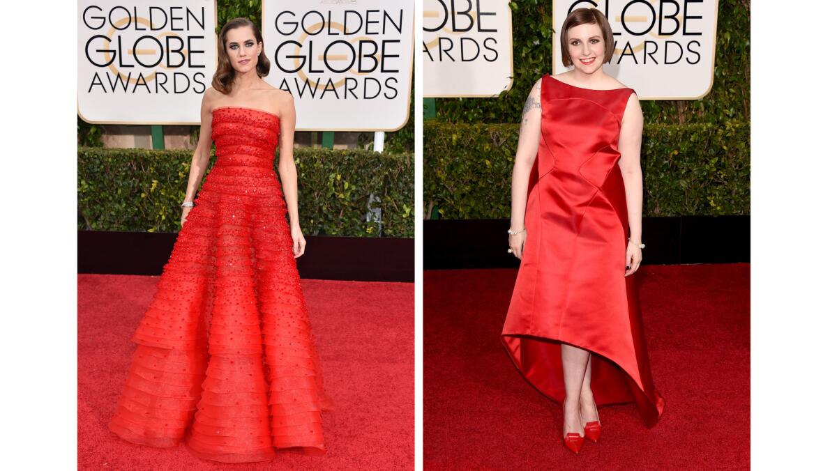 "Girls" are all right in red: Allison Williams, left, in a strapless crimson gown by Giorgio Armani, and Lena Dunham in Zac Posen.