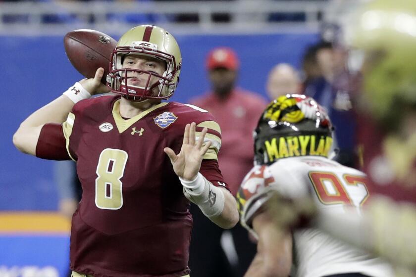 Boston College quarterback Patrick Towles (8) threw two touchdown passes in the first half of the Quick Lane Bowl on Monday.