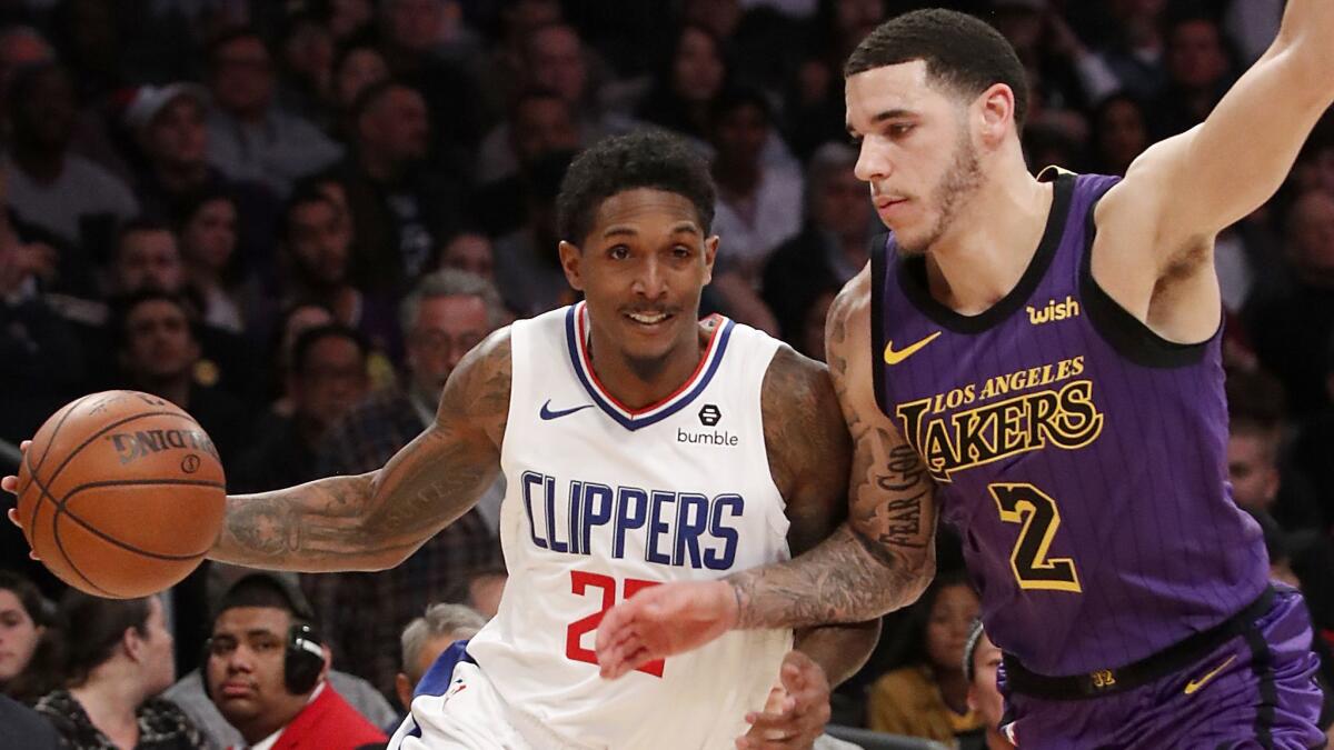 Clippers guard Lou Williams drives to the basket against Lakers guard Lonzo Ball in the third quarter Friday night at Staples Center.