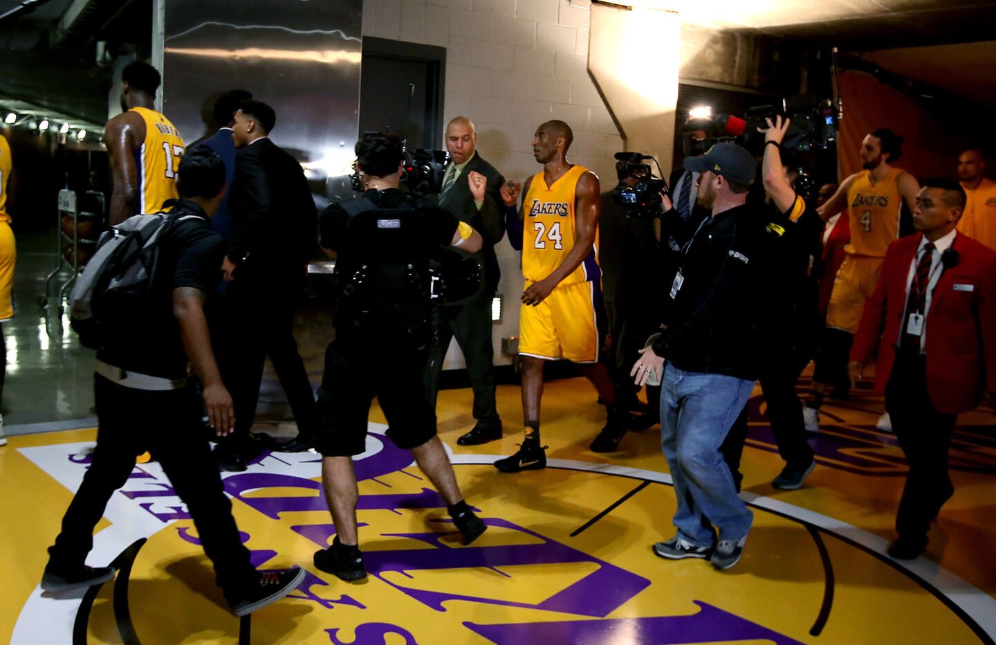 Lakers star Kobe Bryant, center, heads to the locker room after scoring 22 points in the first half of his final game on Wednesday, April 13, 2016, at Staples Center in Los Angeles.