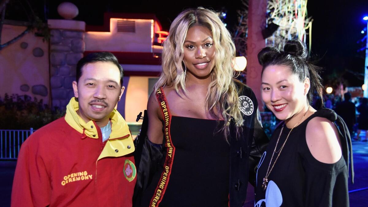 Laverne Cox, center, shown with Opening Ceremony co-founders Humberto Leon and Carol Lim.