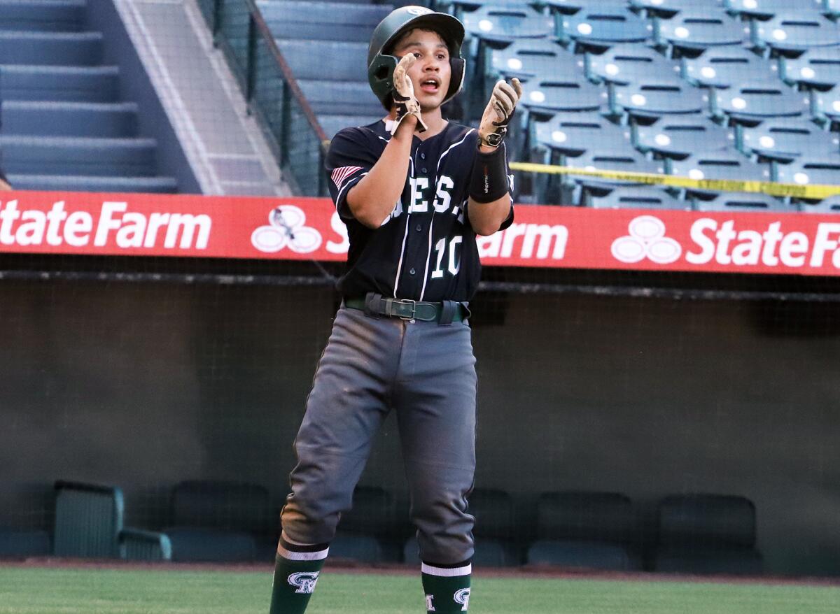 Costa Mesa's Isaiah Mamian (10) claps after scoring against Estancia at Angel Stadium on March 20.