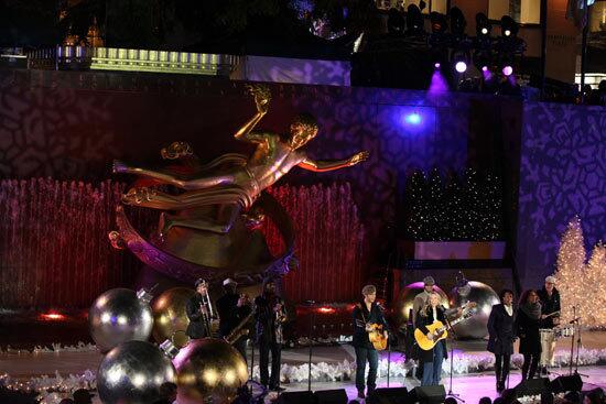 Sheryl Crow performs in front of the famous statue of Prometheus at Rockefeller Center.