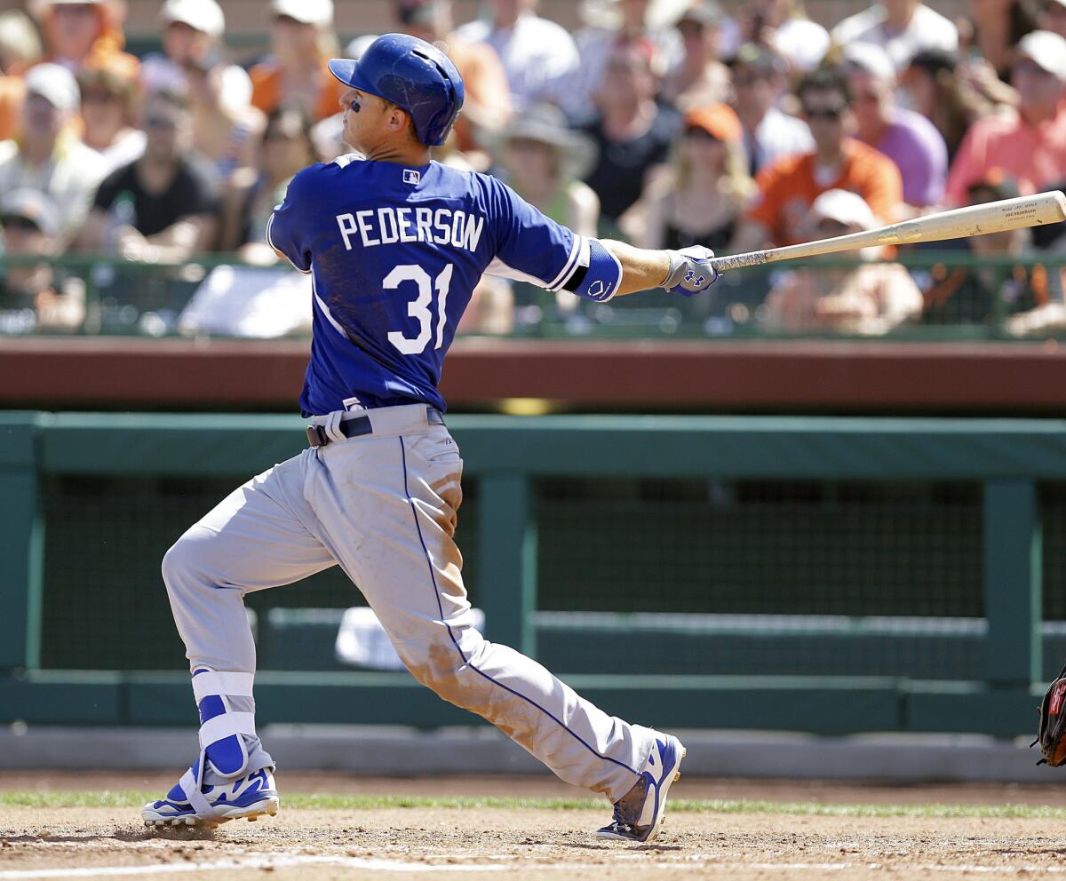 Dodgers outfielder Joc Pederson hits a third inning home run against Giants pitcher Matt Cain in a spring training game Sunday.