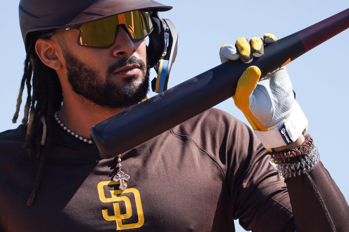 Fernando Tatis Jr. walks back to the dugout