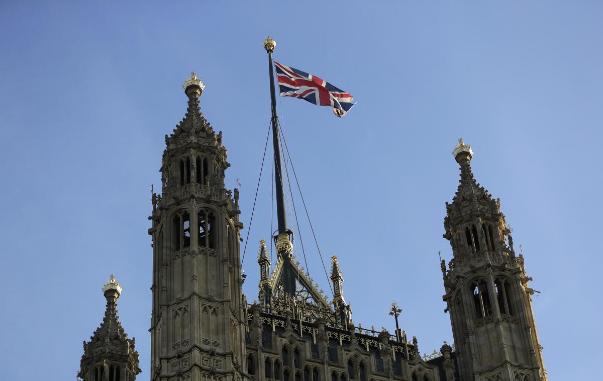 The Union Jack flies above Britain's House of Lords in London in August. An analysis found that ethnic minorities have a significantly heightened risk of COVID-19-related death compared with those who identified themselves as white.