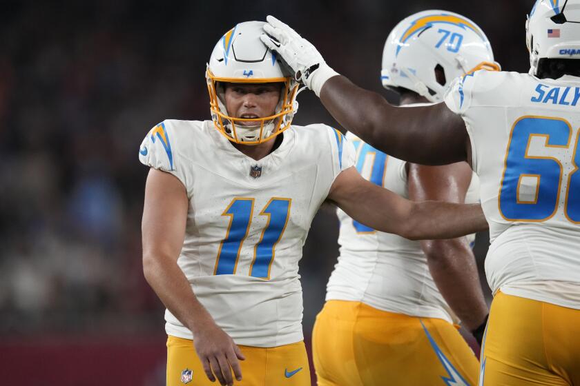 The Chargers' Cameron Dicker (11) celebrates after his field goal against the Arizona Cardinals.