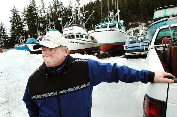 Mike Maxwell stands near dry-docked boats in Cordova, Ak. The herring that used to be so plentiful in the area, and a steady source of income for Maxwell and other fishermen, disappeared four years after the Exxon Valdez spill in 1989. For the rest of the country, Exxon happened a long time ago. For me, for the people I grew up with, the oil is still spilling," he says.