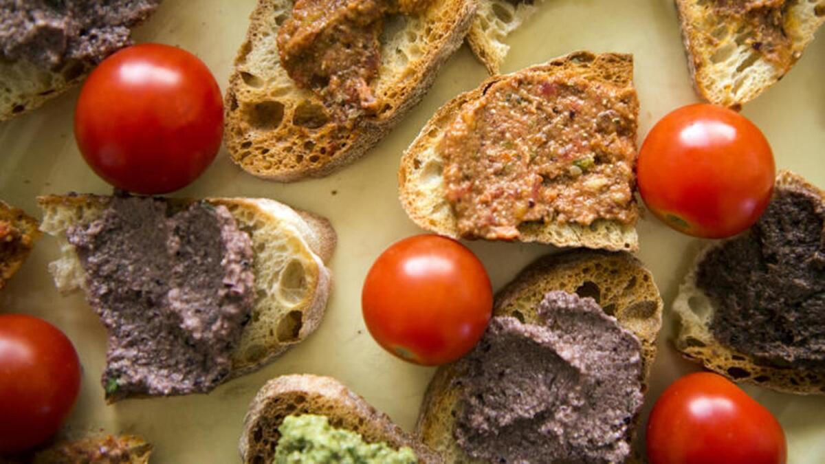 Tapenade, the Provençal dish, is made by combining mashed olives with a variety of other ingredients.