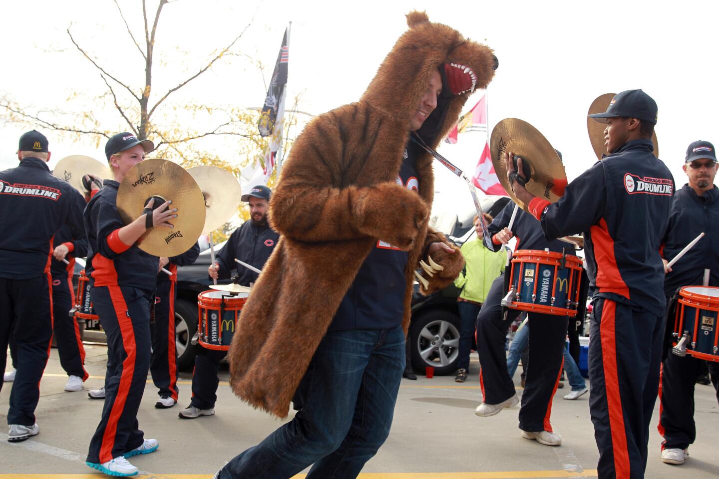 Matt Vitiello dances as the Chicago Bears' drumline plays before game against New Orleans Saints in NFL game at Soldier Field in Chicago on Sunday.
